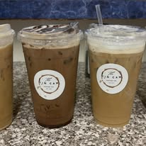 Four iced coffees in clear cups with branded labels at Bonnie's