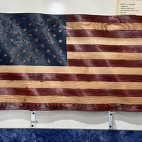 Handmade wooden American flag mounted on the wall inside Bonnie's