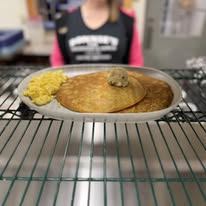 Fluffy buttermilk pancakes with scrambled eggs and sausage patty at Bonnie's